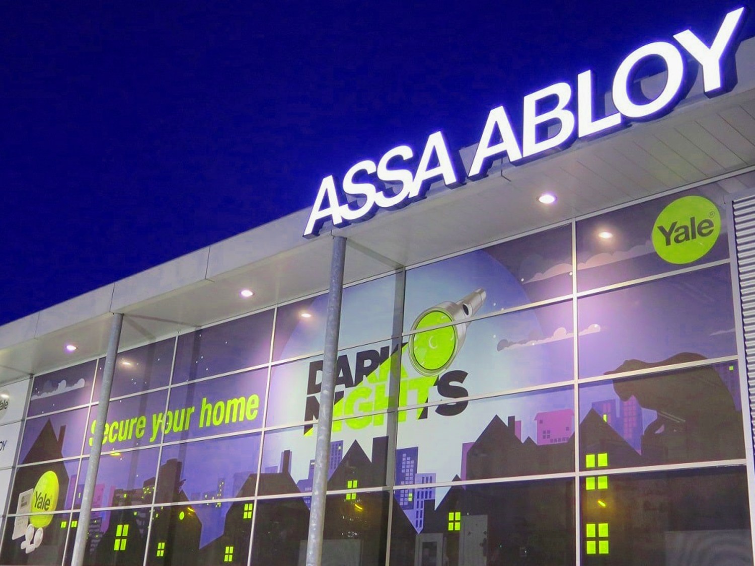 Assa Abloy building exterior with illuminated signage and Yale branding